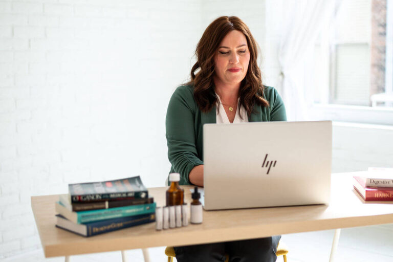 Jacqueline with laptop at desk